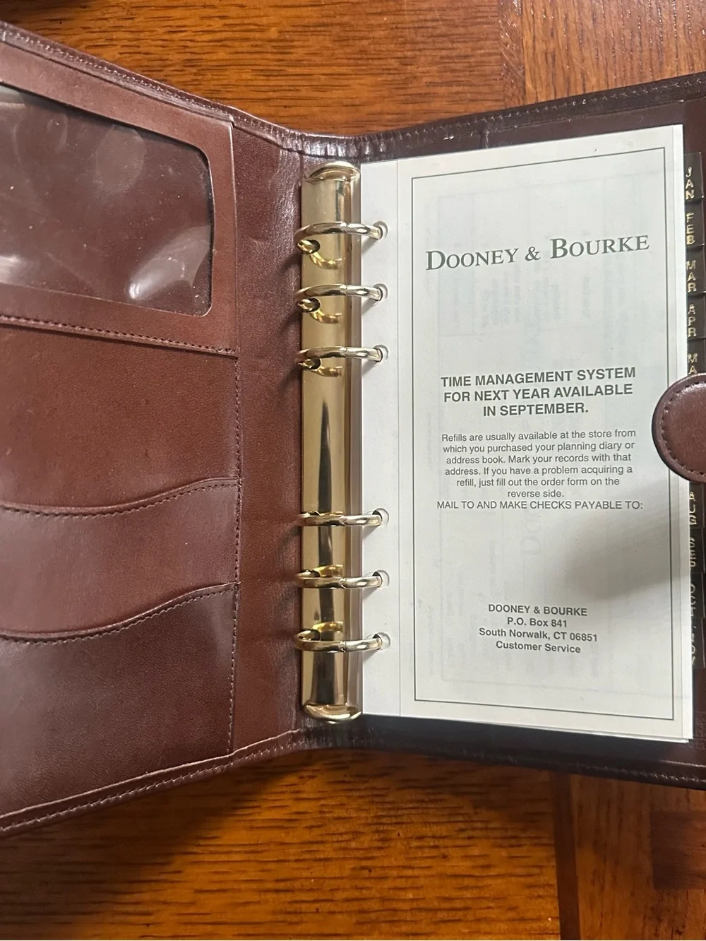 Dooney & Bourke 1999 address Black Pebbled Leather Folio with Brown Trim